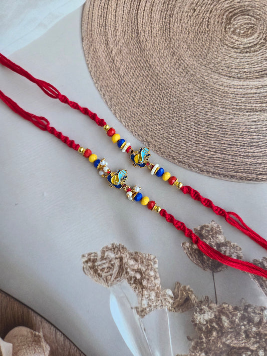 Divine Ganpati Couple Rakhi Set with Multicolor Beads